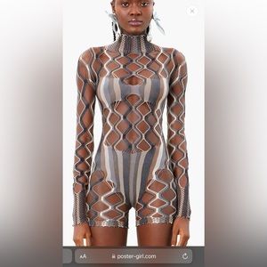 Poster girl romper. One size. Worn once and dry cleaned. Very stretchy.